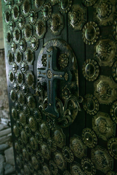 istock Cast iron door to the monastery, the monastery gate 672096950