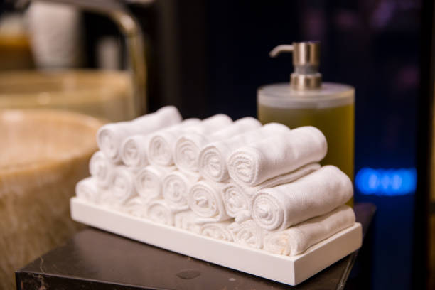 istock stack of white towels in rolls in toilet 672113924
