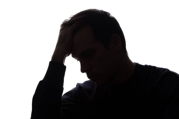 istock A young man with grief tearing at her hair 672116186