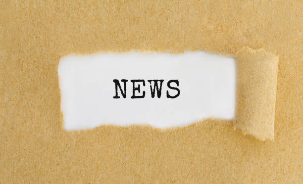 istock Text News appearing behind ripped brown paper. 672123816