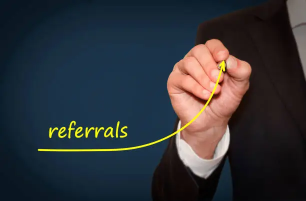 Photo of Businessman draw growing line symbolize growing referrals