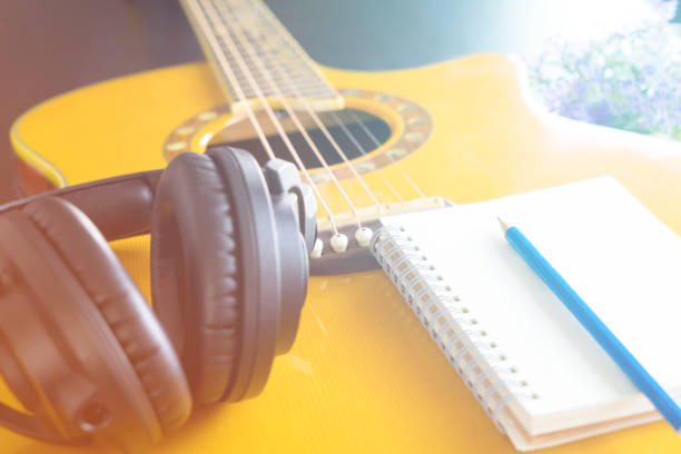 istock Guitar and Headphone notebook for songwriting 672129916
