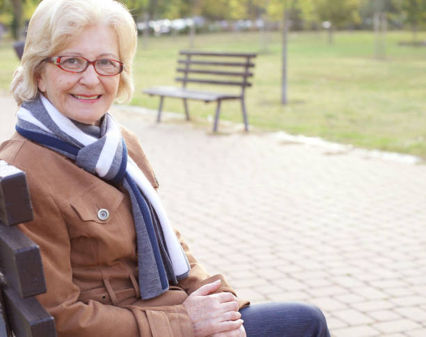 istock Senior woman at park 672130982