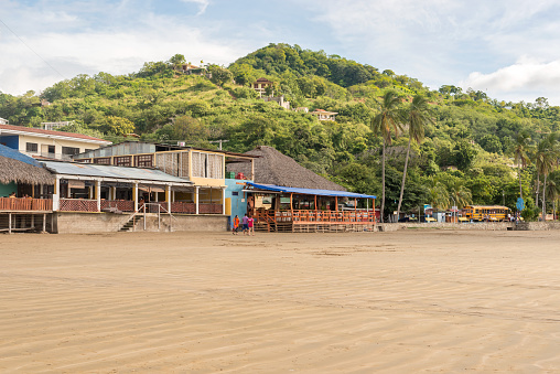 San Juan del Sur, Nicaragua November 18, 2016:  Main beach of San Juan del Sur, and various restaurants and hotels overlooking Pacific Ocean shore.