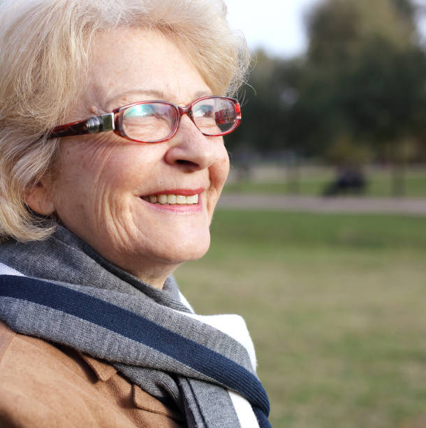 istock Relaxed woman in the park 672137714