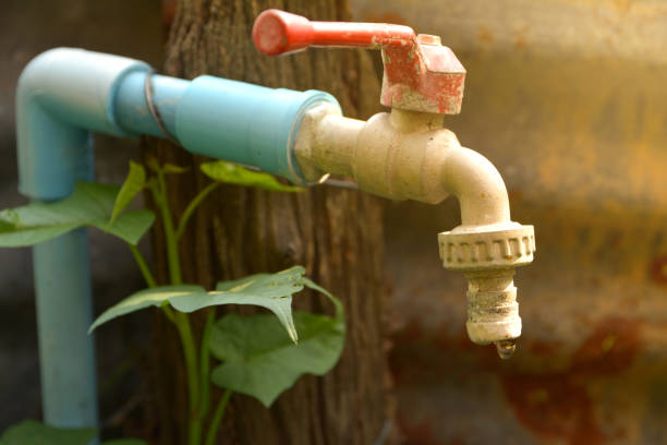 istock Water tap with water drop with green leave 672142886