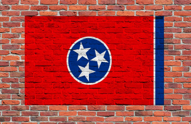 istock Flag of Tennesse State painted over brick wall 672153196