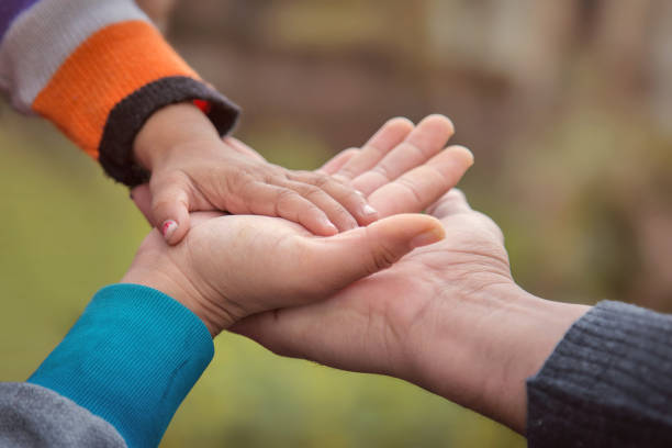 istock Father's mother's and baby's hand 672156592