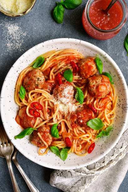 istock Spaghetti with meatballs in tomato sauce 672162380