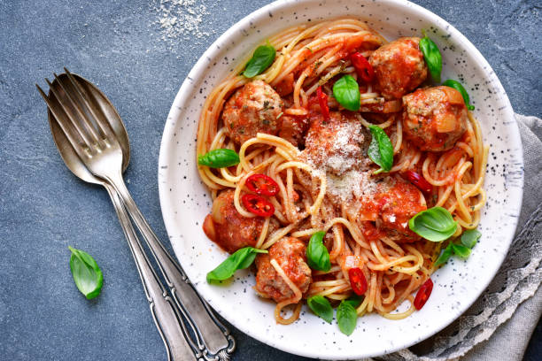istock Spaghetti with meatballs in tomato sauce 672162464