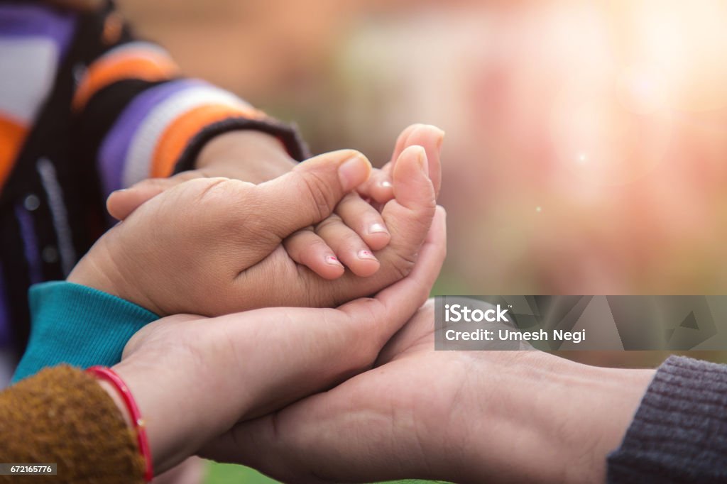 Father's mother's and baby's hand Child Stock Photo