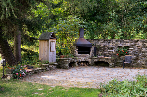 Hearth and wood in the garden. Czech Republic