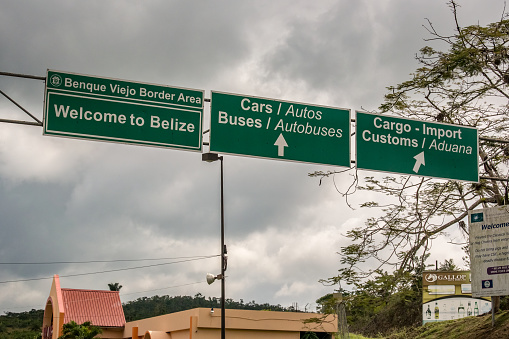 San Ignacio: Border sign above the road in Belize and Guatemala border near San Ignacio in Belize.