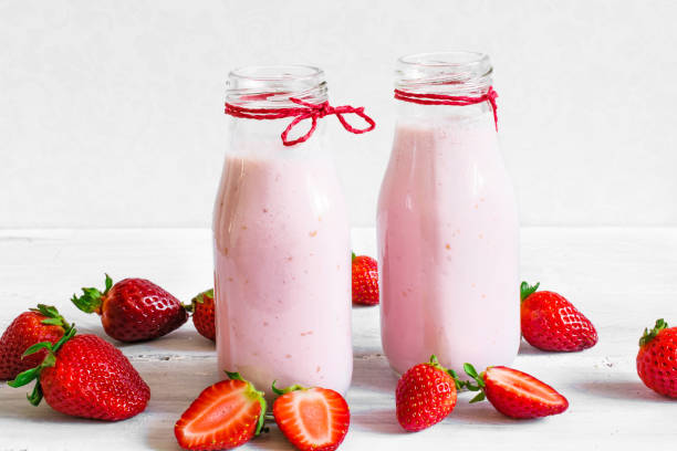 istock Strawberry smoothie or milkshake in a bottle with fresh berries 672179424