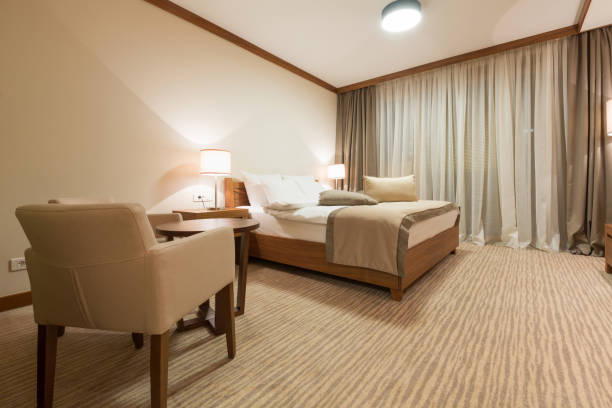 istock Hotel apartment, bedroom interior in the evening 672184930