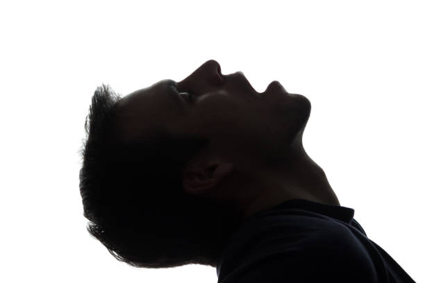 istock Portrait of young man with his mouth open, side view 672184948