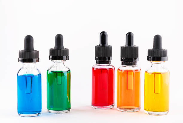 istock transparent glass bottles filled colored liquid with dropper 672187088
