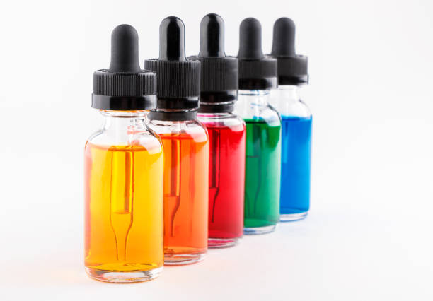 istock transparent glass bottles filled colored liquid with dropper 672187908