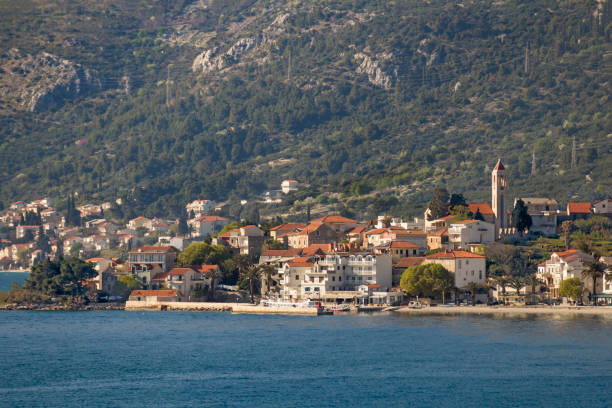istock Hill and houses at sunset 672188790
