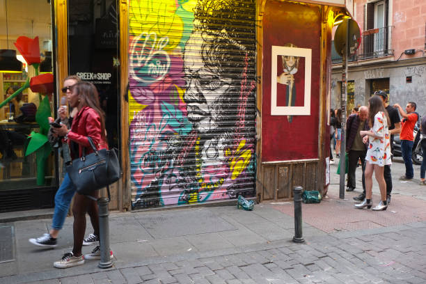 Artist take parta at event ¡Pinta Malasana! Artists, illustrators and graphic designers of color fill the streets of the District of Malasaña. In total there are 100 selected artists to paint in 100 shutters, wooden doors, crystals... in the centre of Madrid on 23 April, 2017.