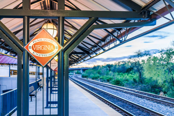 Burke Centre train station platform with Railway Virginia Express sign and tracks Burke: Burke Centre train station platform with Railway Virginia Express sign and tracks fairfax virginia photos stock pictures, royalty-free photos & images