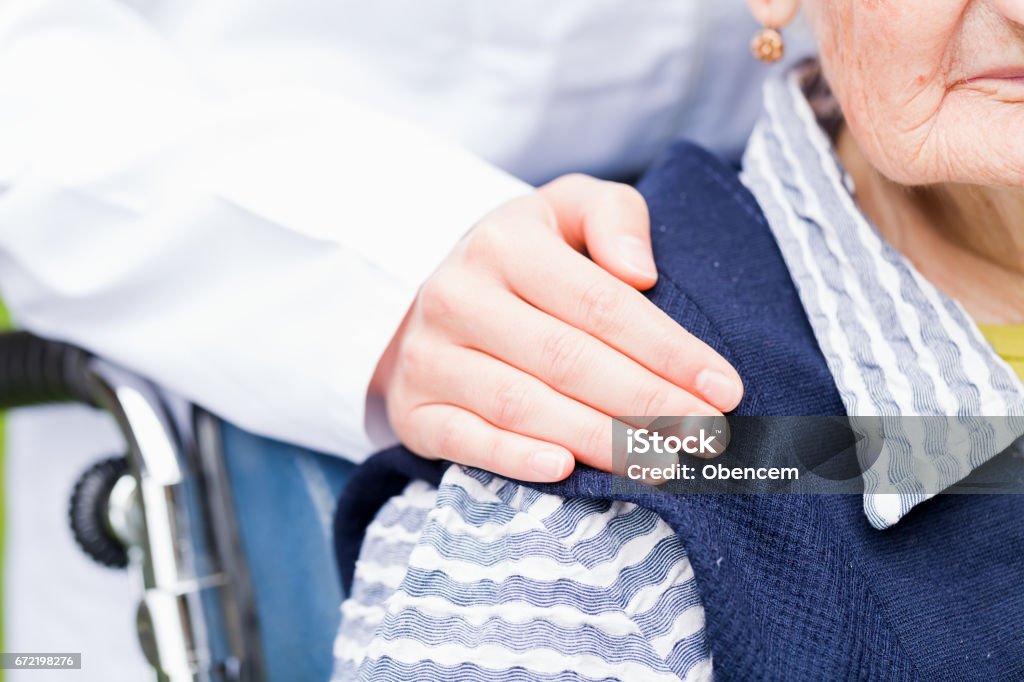 Elderly care Photo of young carer helping the elderly woman A Helping Hand Stock Photo