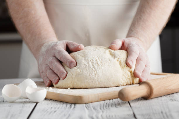 istock pizza prepare dough hand topping 672207544