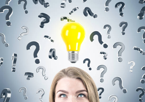istock Blond businesswoman, questions and light bulb 672214240