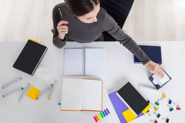 istock Top view of female designer working 672217194