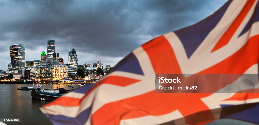 union jack flag over London financial district with iconic skyscrapers, UK prepares for elections after Brexit UK Stock Photo