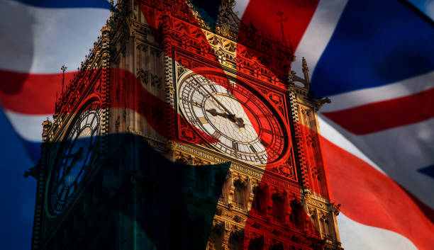 union jack flag and iconic Big Ben at the palace of Westminster, London - the UK prepares for new elections union jack flag and iconic Big Ben at the palace of Westminster, London - the UK prepares for new elections big ben photos stock pictures, royalty-free photos & images