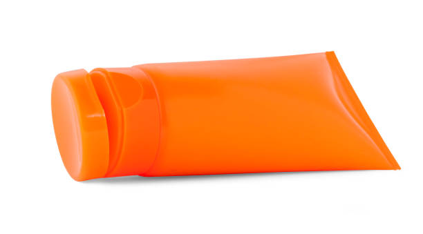 istock Orange plastic bottle for beauty product on white background 672220358