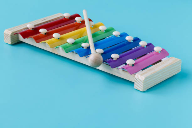 istock Bright Glockenspeil for kids isolated on aquamarine background 672223302
