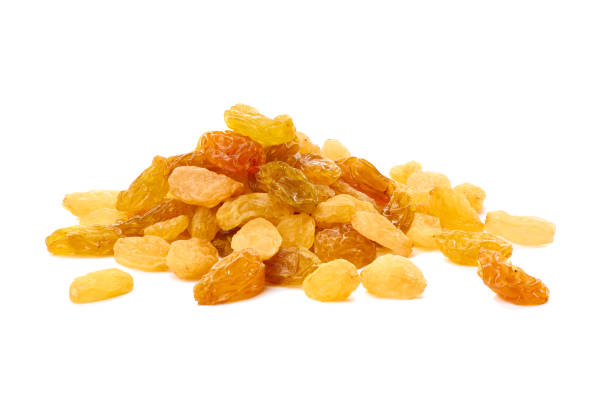 istock Heap of raisins on white 672232940