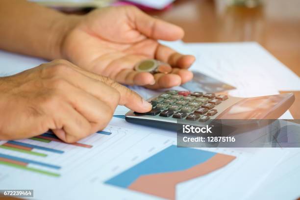 Dane Using Calculator Men Are Using A Calculator To Analyze Income Data Stock Photo ...