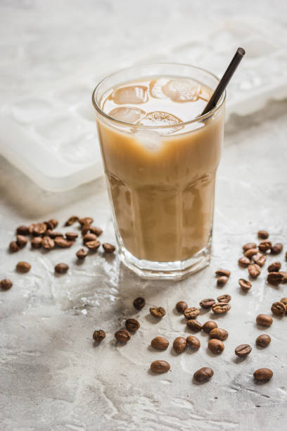 istock iced coffee with beans for cold summer drink on stone background 672253086