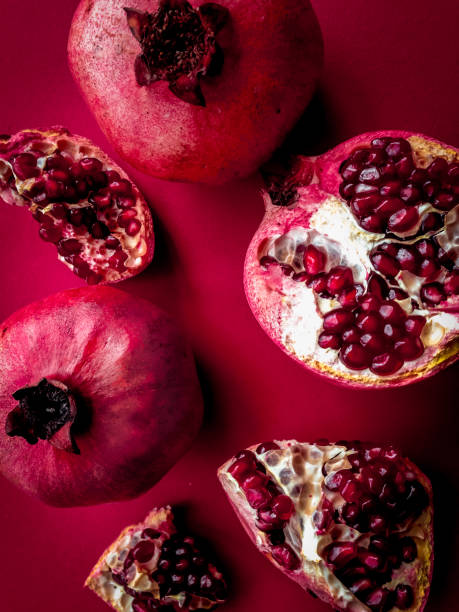istock red color set with ripe pomegranate top view 672253552