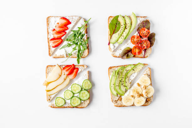 istock sandwiches set on white table background top view 672256088
