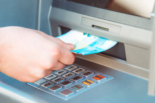 istock Getting the cash from ATM 672256112