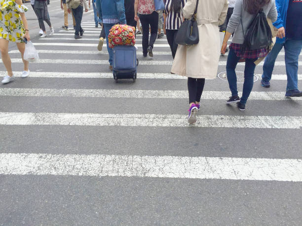 istock Pedestrians walking on crosswalk 672256186