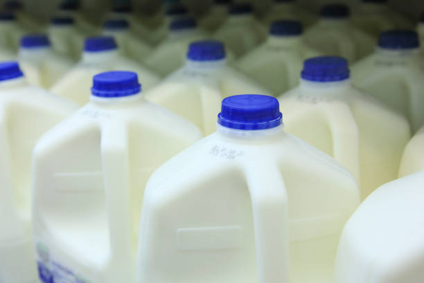 Gallons of Milk Gallons of fresh milk in freezer. gallon stock pictures, royalty-free photos & images