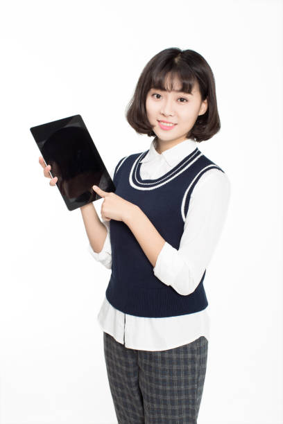 istock pretty chinese girl and her tablet PC 672265622