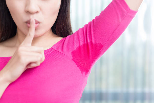 istock woman with body odor 672268474