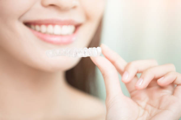 istock woman with invisible braces 672271802