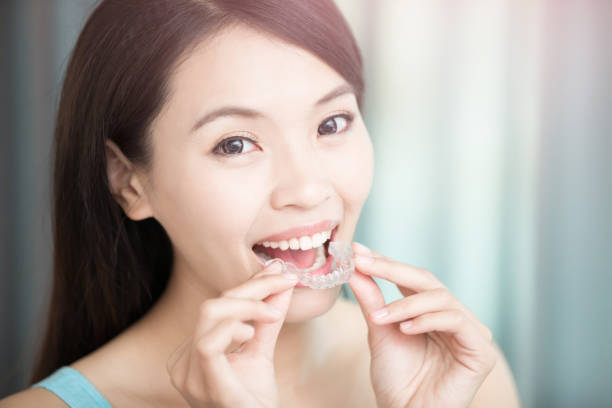 istock woman with invisible braces 672271924