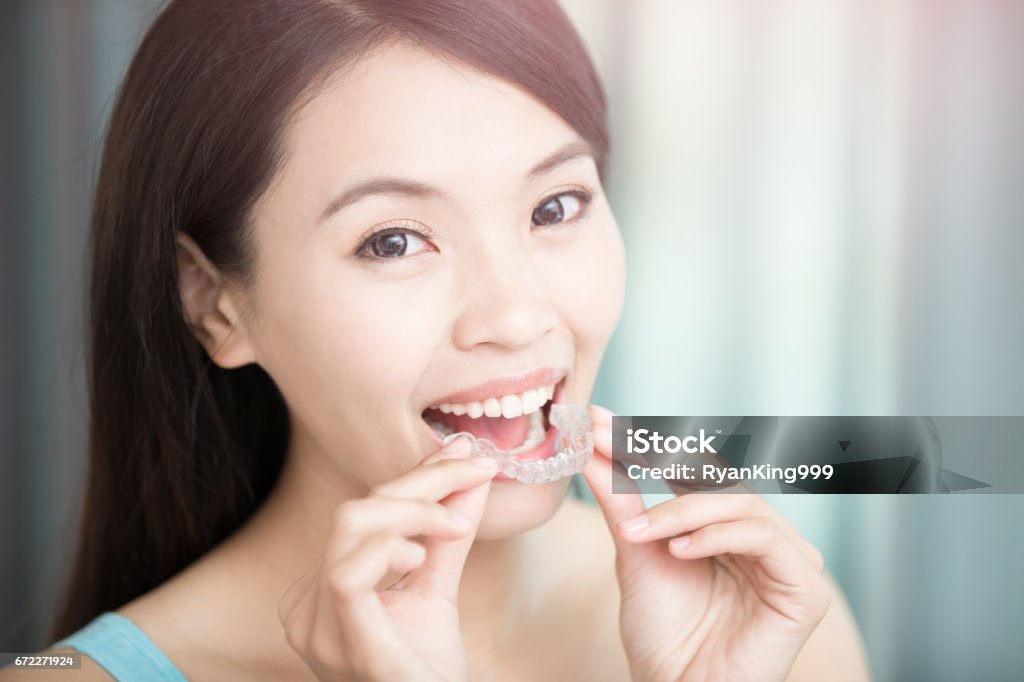 woman with invisible braces beauty woman smile happily with invisible braces Dental Aligner Stock Photo