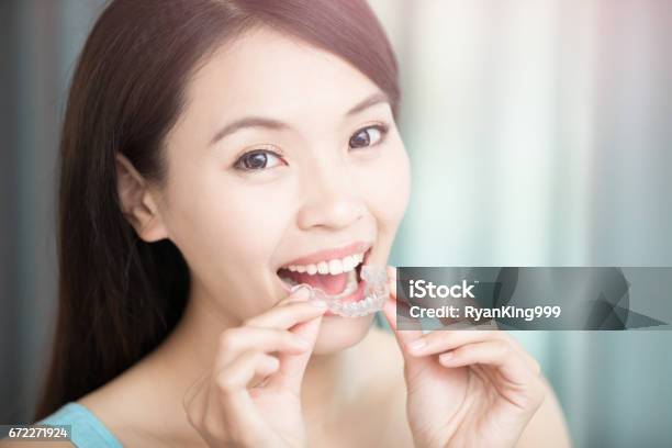 Woman With Invisible Braces Stock Photo - Download Image Now - Dental Aligner, Women, China - East Asia