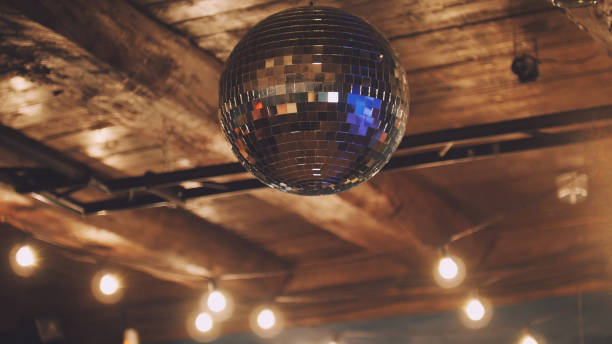 istock Night club - disco ball at ceiling 672272432