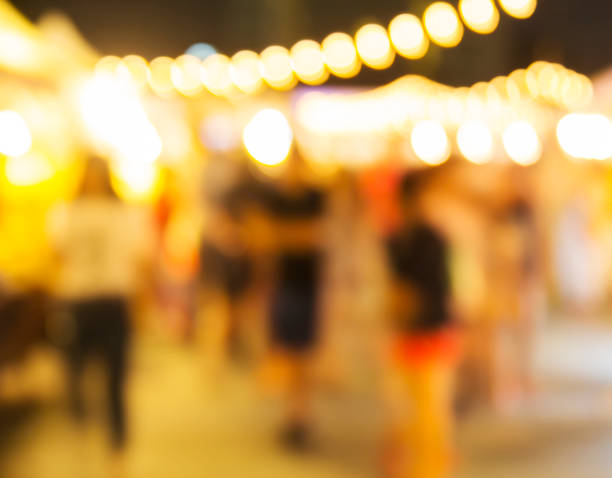 istock Abstract blurred lights of night market 672272860