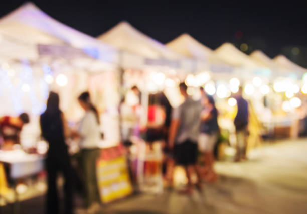 istock Abstract blurred lights of night market 672272868